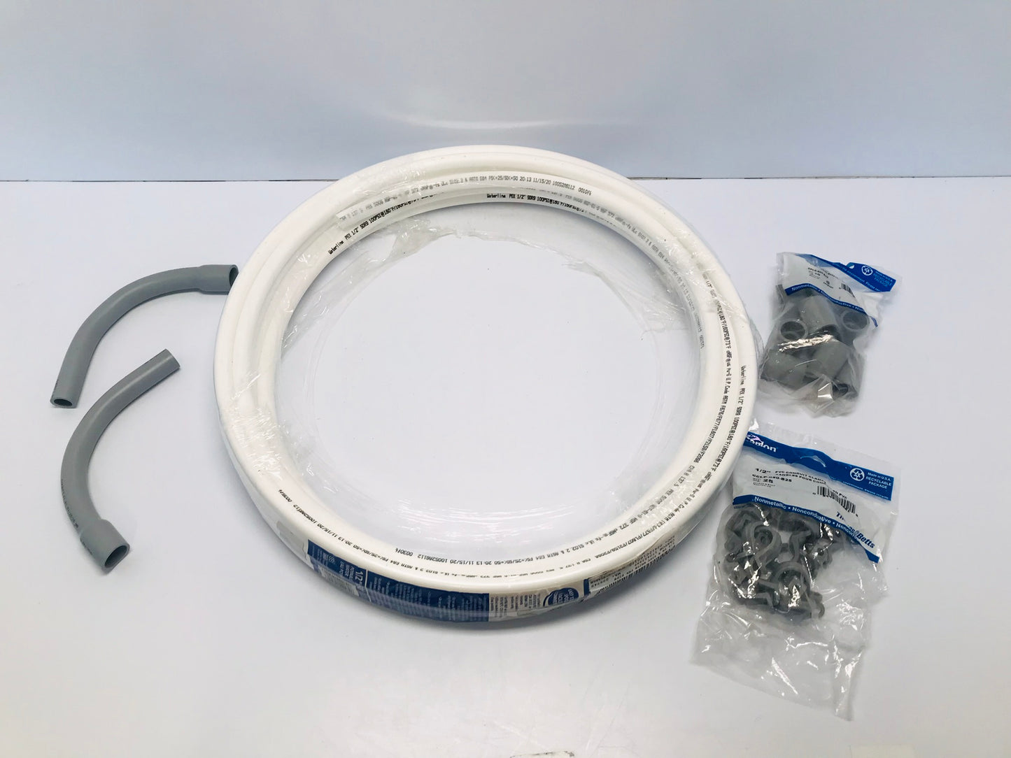 New 12 inch x50 Feet White PEX Pipe Water  Sprinkler With Conduit Clamps New Sold As A Set