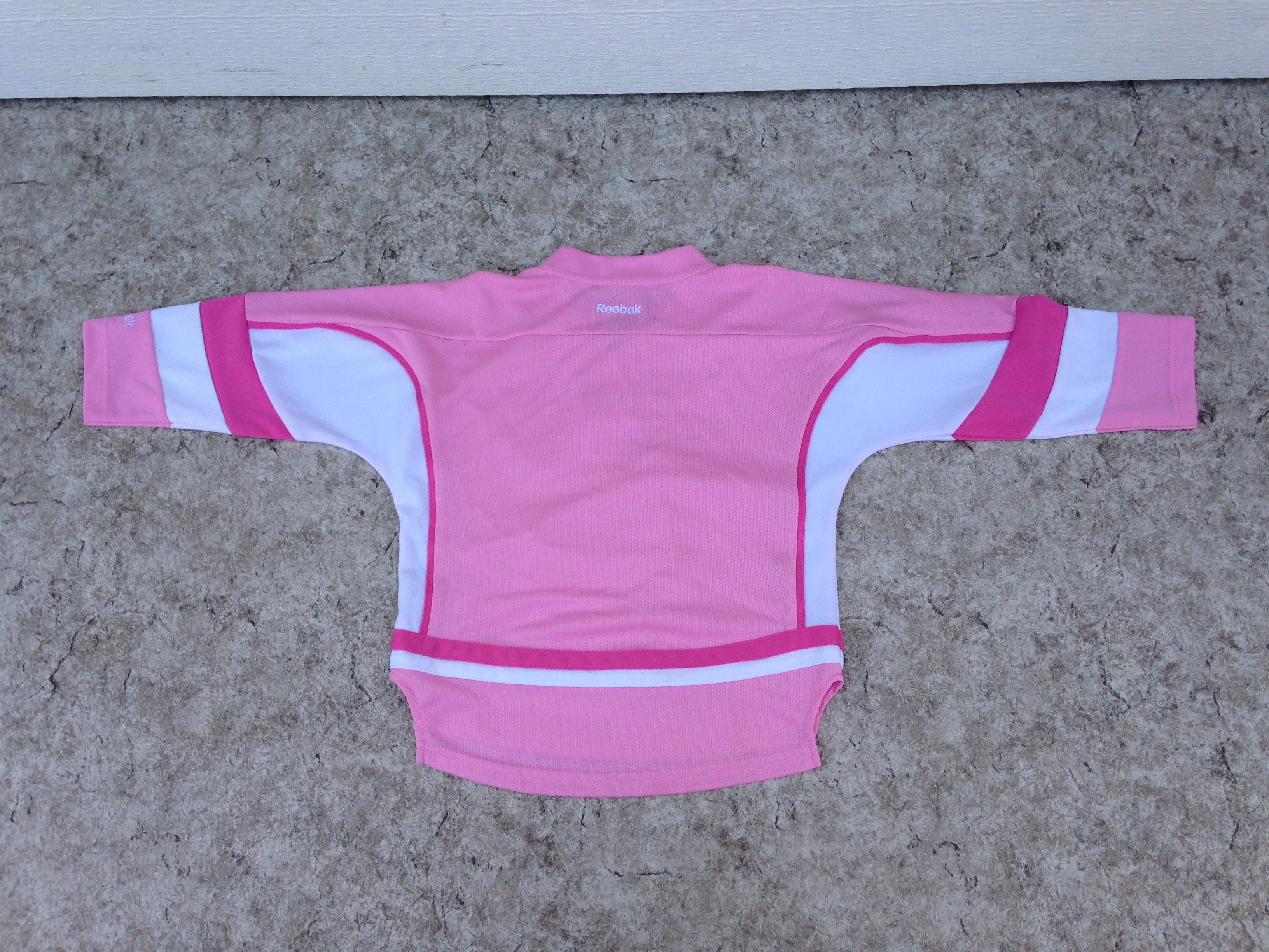 Hockey Jersey Child Size 4 Reebok Vancouver Canucks Pink New Demo Mode KidsStuffCanada
