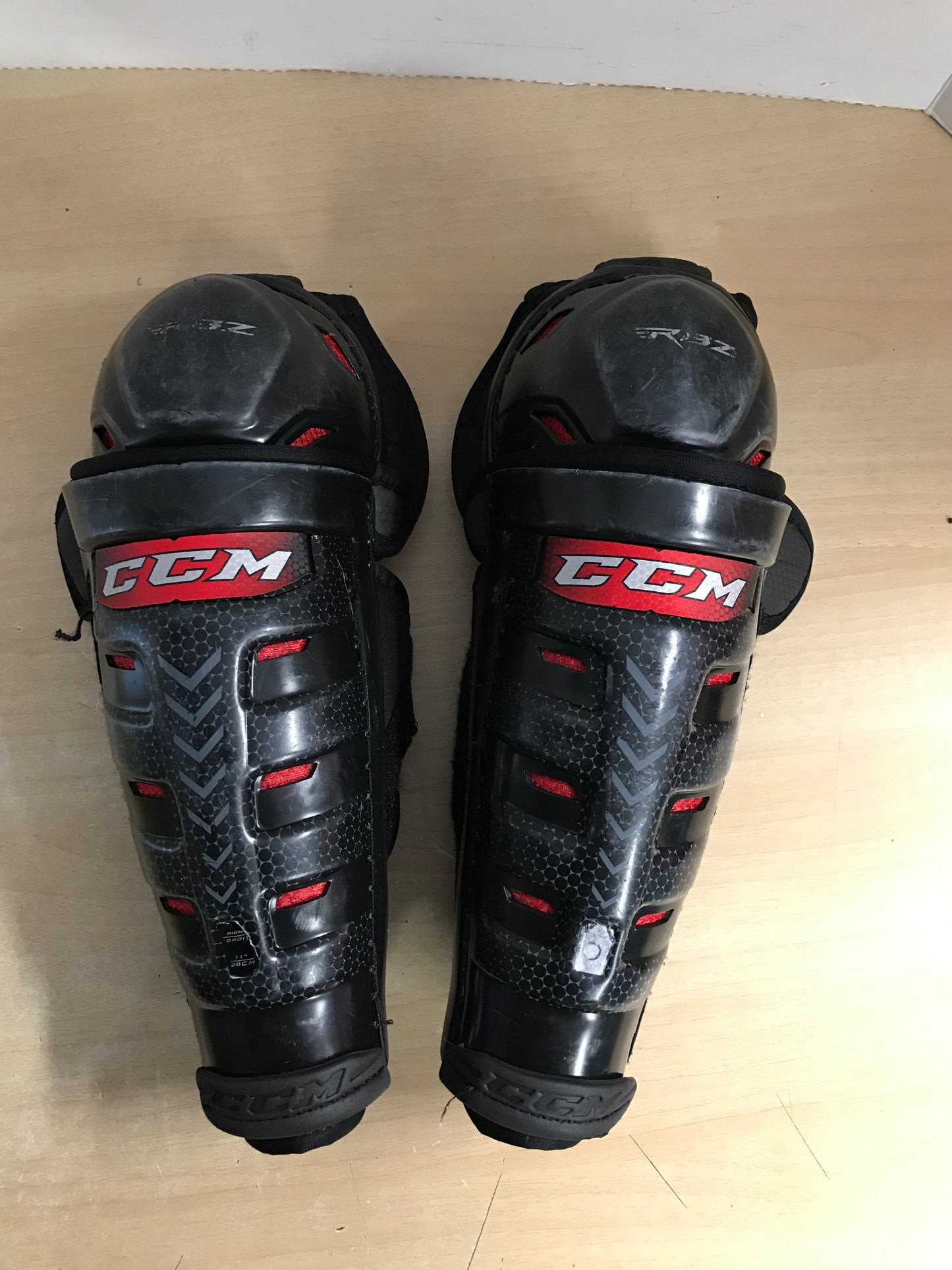 Hockey Shin Pads Child Size 11 inch CCM Slim Black Red Calf Wrap Minor Wear